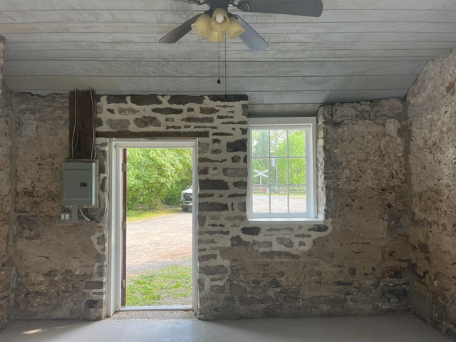 Interior of stone building towards open door